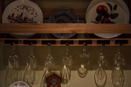 a shelf filled with lots of dishes and lights at Vienna House by Wyndham MQ Kronberg in Kronberg im Taunus