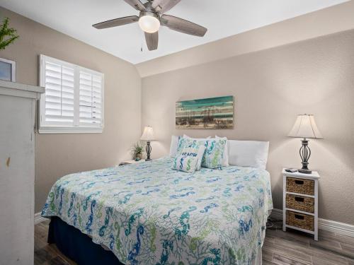 a bedroom with a bed and a ceiling fan at LR 205 - La Las in Rockport