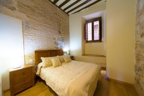 Postel nebo postele na pokoji v ubytování Apartamentos del Casco