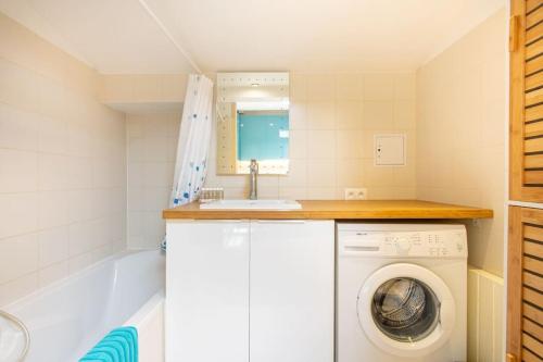 a laundry room with a washing machine and a sink at Cosy apt for 6/8p best location in old Antibes in Antibes