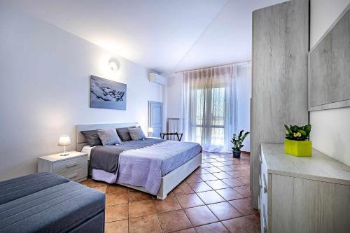 A bed or beds in a room at Il terrazzo sul tramonto