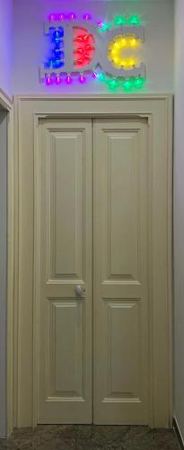 a white door with lights on top of it at Dimora Casanello in Lecce