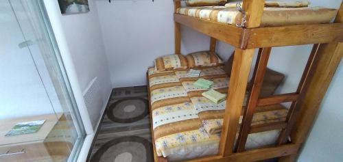a bunch of cheese on a shelf in a room at Apartman na Drini in Foča