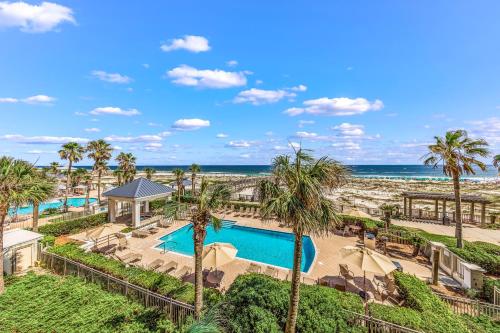 a view of the pool and beach at the resort at Beach Club 708D in Gulf Shores