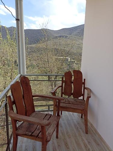 two chairs sitting on a porch with a view at Green Garden in Ijevan