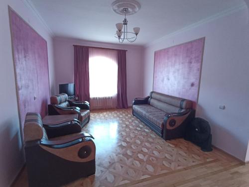a living room with a couch and two chairs at Green Garden in Ijevan