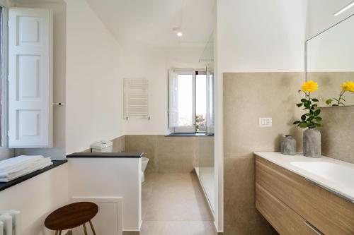 a bathroom with a tub and a sink and a toilet at Etna Retreat in Castiglione di Sicilia