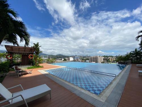 a large swimming pool on top of a building at Cebu One Pavillion Place by P&J in Cebu City