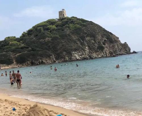a group of people in the water at a beach at Private Pool villa with panoramic views split over 2 levels / Aircon / New Pool. in Chia