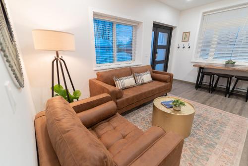 a living room with a couch and a table at Colony Suites in Palmer