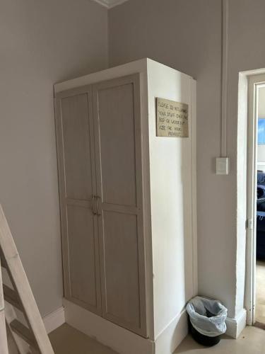 a cabinet in the corner of a room at Cozy Crner Kitehouse in Langebaan