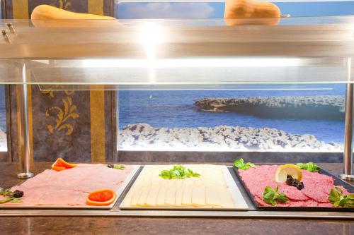 a display case with different types of food in it at Mix Peymar in S'Illot