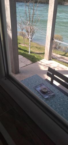 a view of the ocean from the window of a house at Apartman na Drini in Foča