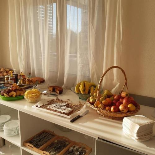a table with a bunch of fruits and vegetables on it at Hotel Miranda do Douro in Miranda do Douro