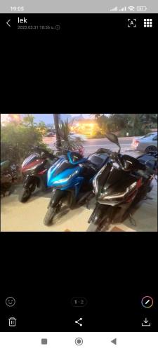 a picture of two motorcycles parked next to each other at Baan Thara Guesthouse in Ao Nang Beach