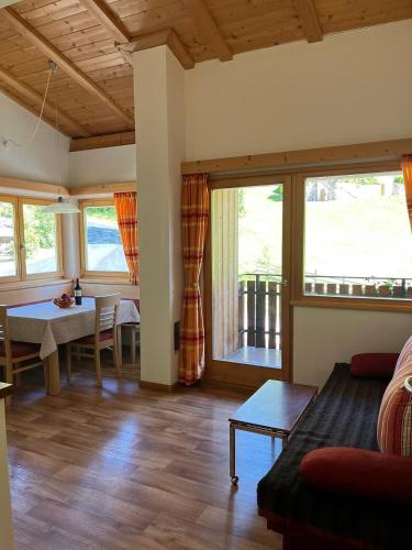 a living room with a couch and a table at Haus Helga in Tires