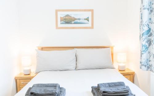 Кровать или кровати в номере Riverside View