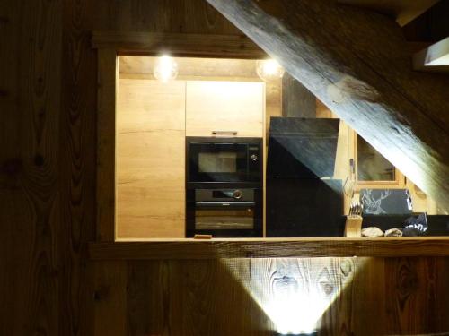 a room with a mirror and a window in a kitchen at Chalet de 6 chambres avec sauna terrasse amenagee et wifi a Font Romeu Odeillo Via a 1 km des pistes in Font-Romeu-Odeillo-Via
