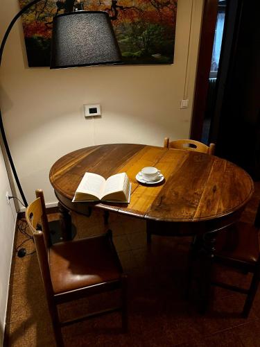 a wooden table with two books on top of it at La Locanda dell'Oreste in Dizzasco
