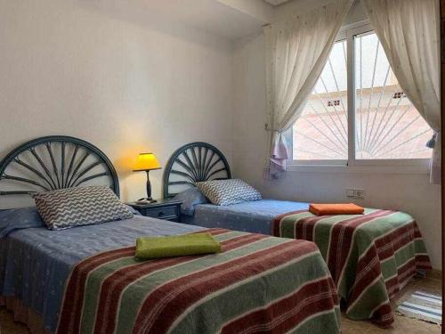 Posteľ alebo postele v izbe v ubytovaní Acogedor duplex en la zona del Golf