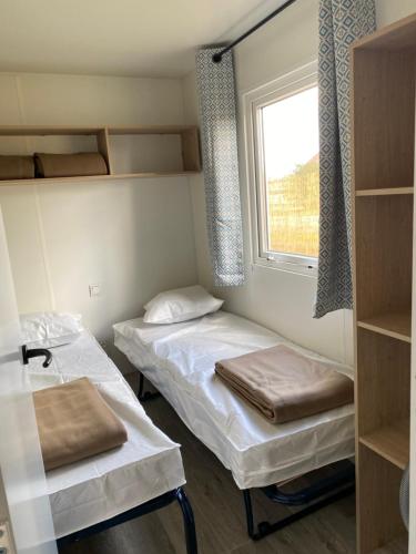 Postel nebo postele na pokoji v ubytování Camping de Contrexeville