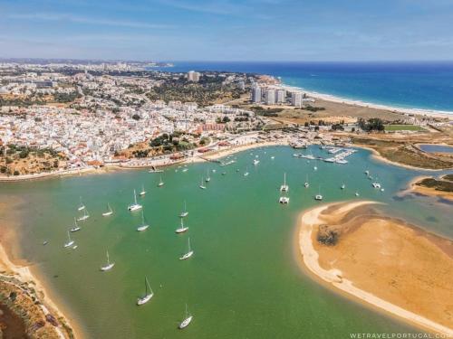an aerial view of a harbor with boats in the water at Alvor Experience in Alvor
