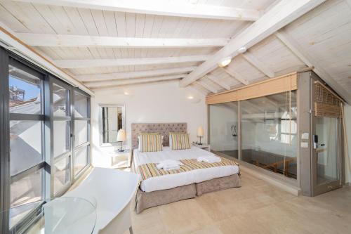 Postel nebo postele na pokoji v ubytování Alp Pasa Fiore Garden Suites - Special Class