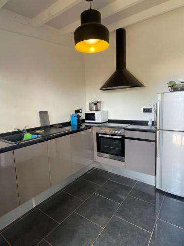 A kitchen or kitchenette at Appart Damazonie T1BIS calme idéalement situé