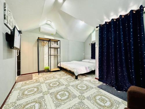 Postel nebo postele na pokoji v ubytování Keyman House Khao Yai