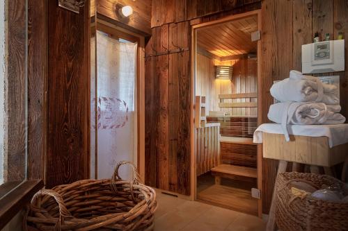 a bathroom with a stack of towels in a room at Widmann's Löwen in Königsbronn