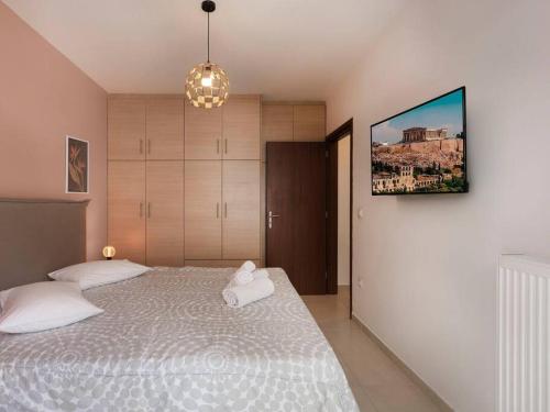 Postelja oz. postelje v sobi nastanitve Pagrati cozy apartment in Athens