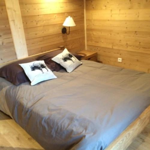 Una cama o camas en una habitación de Les Etoiles de Vonnes 1
