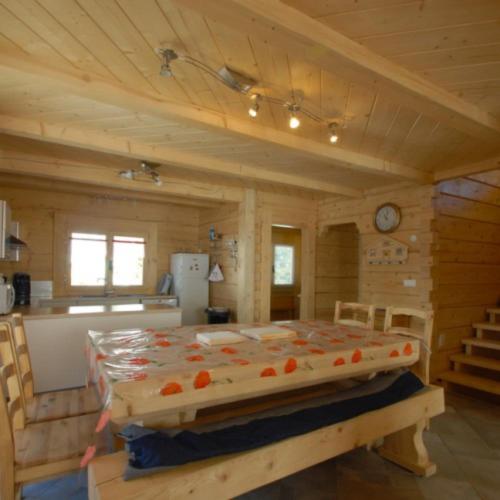 a bedroom with a large bed in a cabin at Chalet Tho'max in Châtel