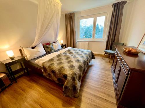 Katil atau katil-katil dalam bilik di Ferienwohnung Waldstadt