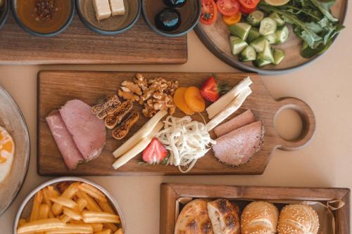 a table with three trays of different types of food at Kalia Beach Hotel Side in Side