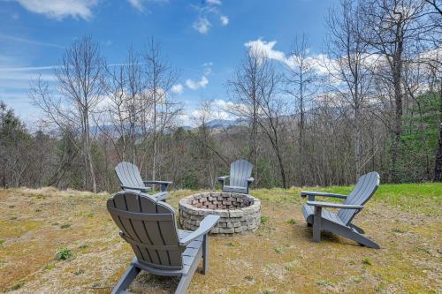 three chairs and a fire pit in a yard at Smoky Mountain Cabin Rental Game Room, Fire Pit! in Andrews