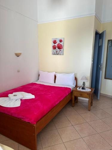 Postel nebo postele na pokoji v ubytování Akteon Rooms