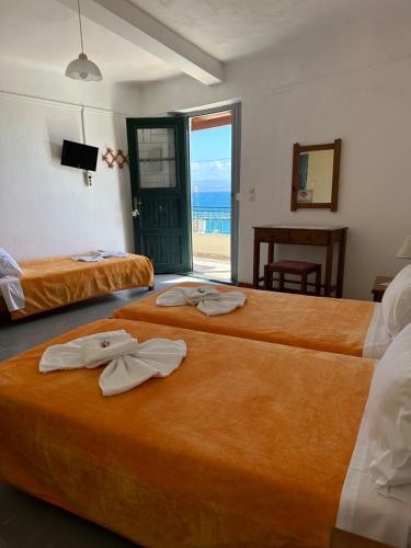 Postel nebo postele na pokoji v ubytování Akteon Rooms