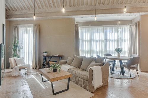 a living room with a couch and a table at Metropolitan Boutique in A Coruña