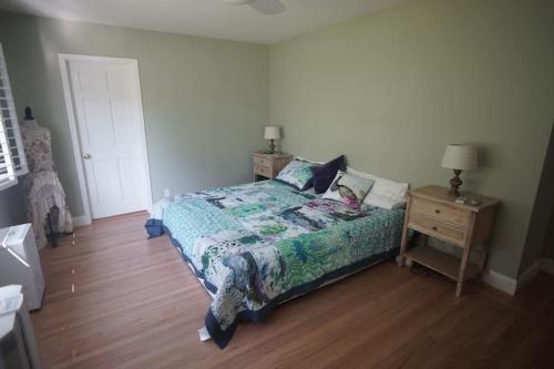 a bedroom with a bed and a wooden floor at North Berkeley Home in Berkeley