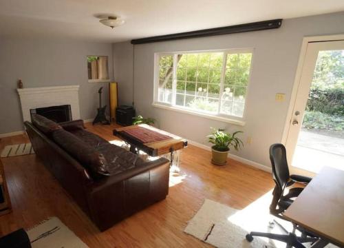 a living room with a couch and a table at North Berkeley Home in Berkeley