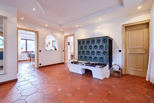 a room with a piano in the middle of a room at Chalet Chiemgau in Reit im Winkl