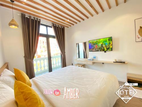 Postel nebo postele na pokoji v ubytování Riverside Mini Hotel Grand World Phu Quoc