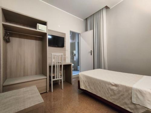 Posteľ alebo postele v izbe v ubytovaní Hotel Vittoria