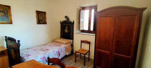 Кровать или кровати в номере Agriturismo Gli Aranci dell'Etna