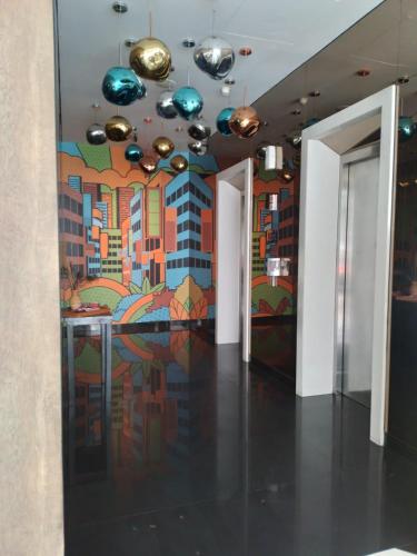 a room with a painting on the wall at Maxone Premier Melawai in Jakarta