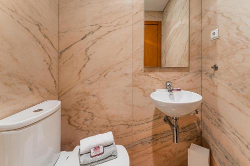 Et badeværelse på Coreto Apartment