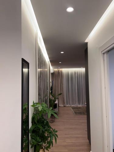 a hallway with green plants in a room at Super Luxury Apartment Ocean View Las Americas Costa Adeje in Adeje