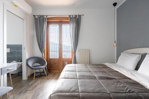Postel nebo postele na pokoji v ubytování SEASCAPE - Noemi's Rooms