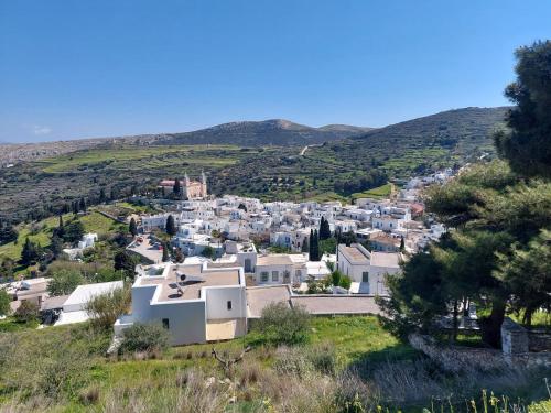 a view of a town from a hill at Sunrise View Lefkes in Lefkes